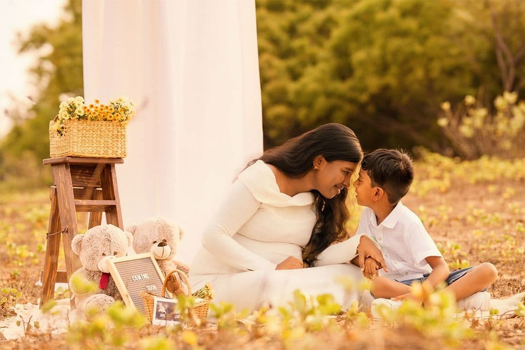 Mother and son sharing a golden-hour moment outdoors